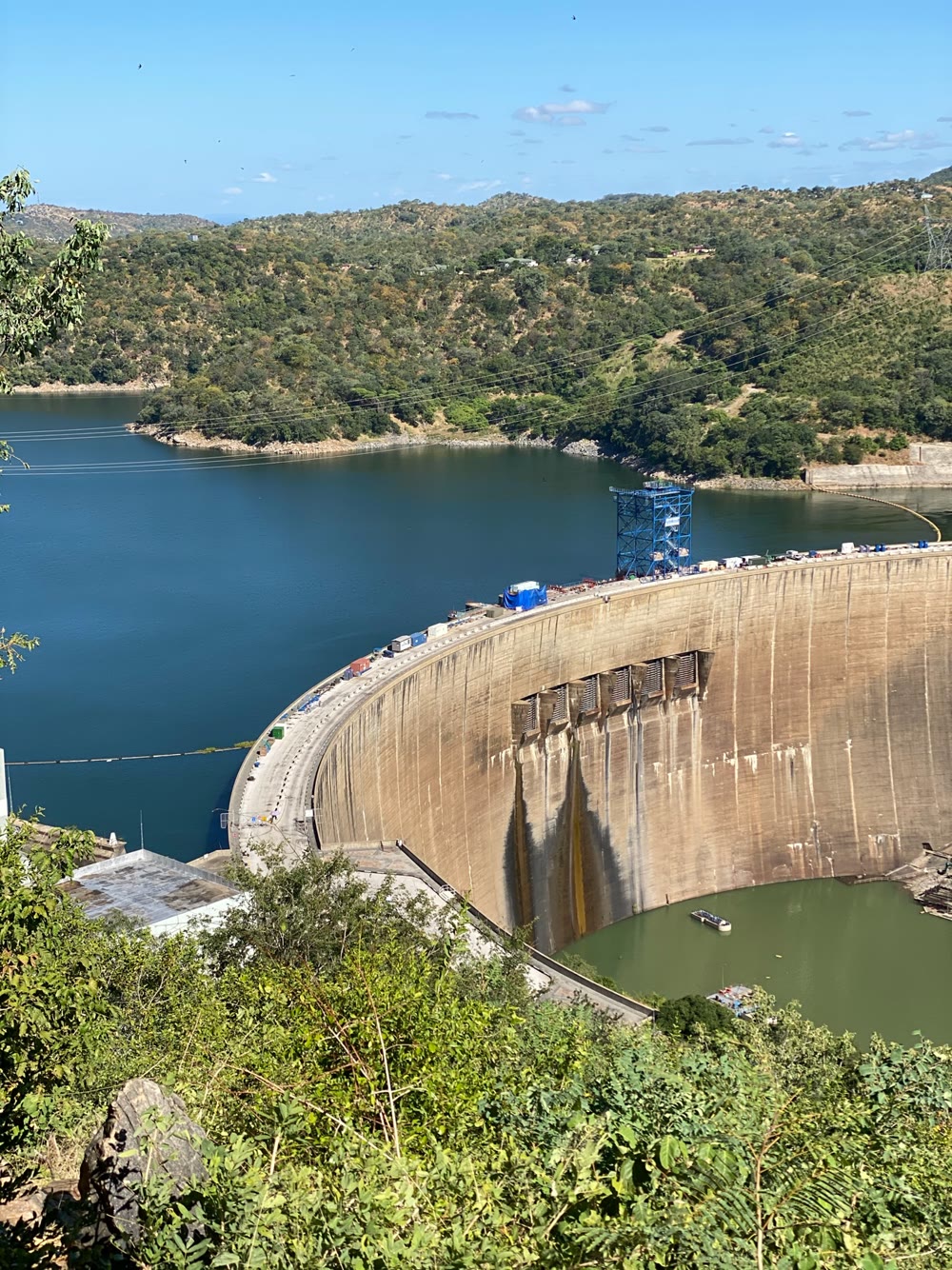 The Kariba Dam wall curving across the Zambezi gorge, Lake Kariba held behind it