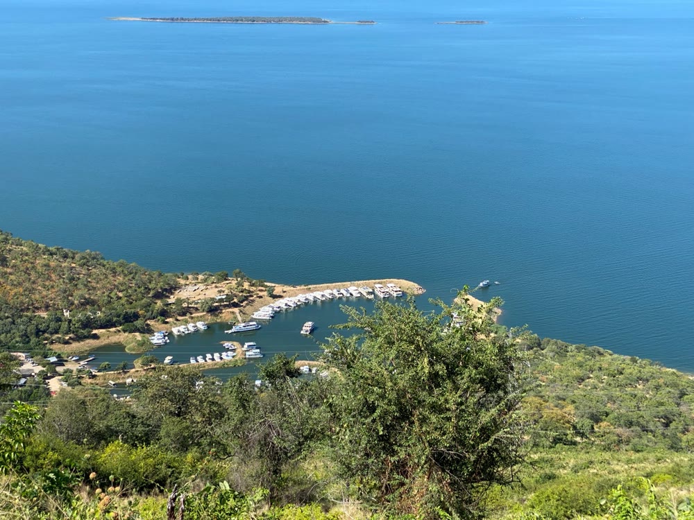 Houseboats moored in the marina at Kariba, seen from the heights above the town, islands on the lake beyond